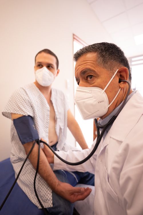 A doctor checking a patient during a consultation